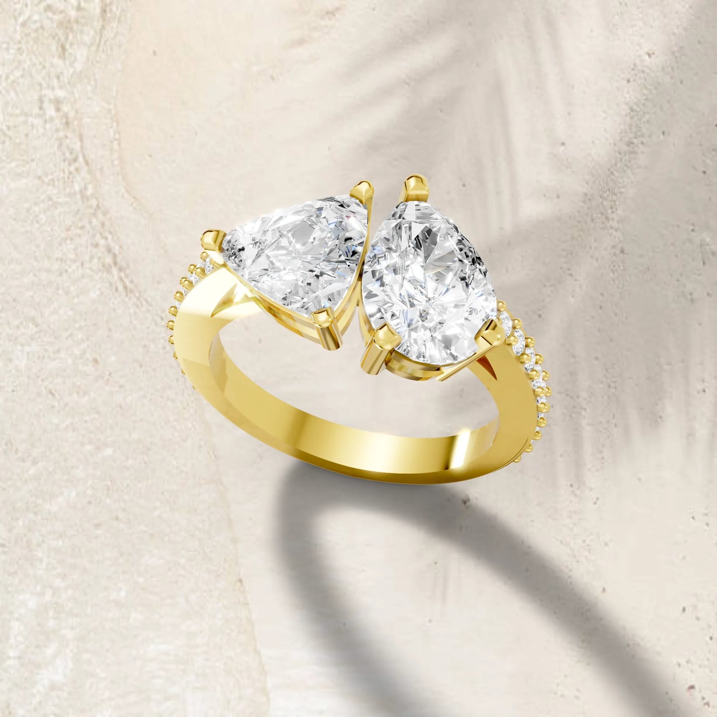 14K Gold Trillion and Pear Cut Diamond Toi et Moi Engagement Ring with Side Accents